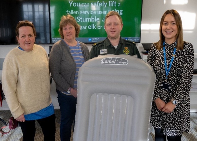 Photo: Matthew Vaughan, Paramedic (Session Facilitator) and Catrin Guest, Project Support Officer, with care home staff in the Health and Care Academy, Bronllys Hospital